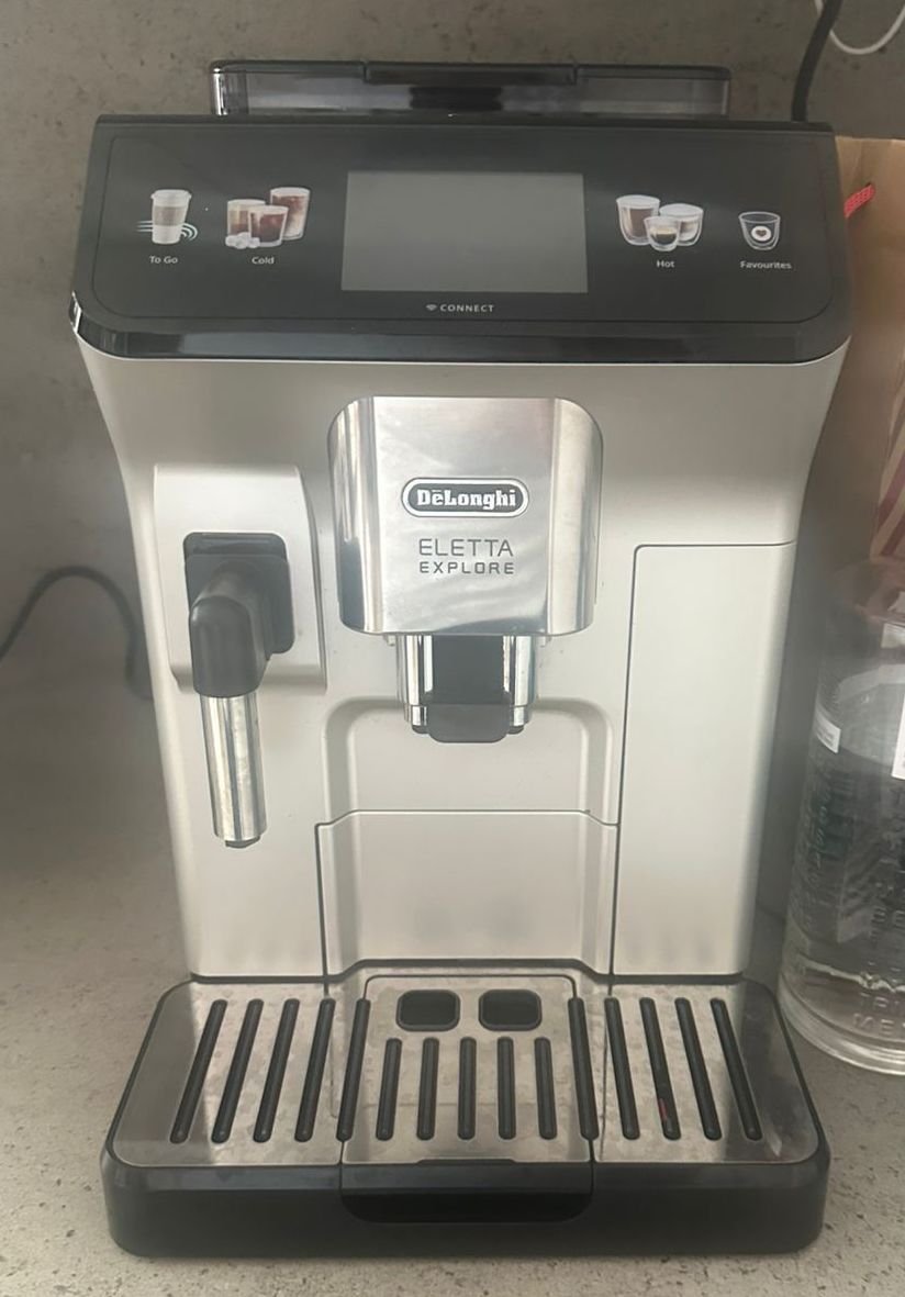 Delonghi coffee machine repair service in UAE – certified technician fixing a De'Longhi espresso machine